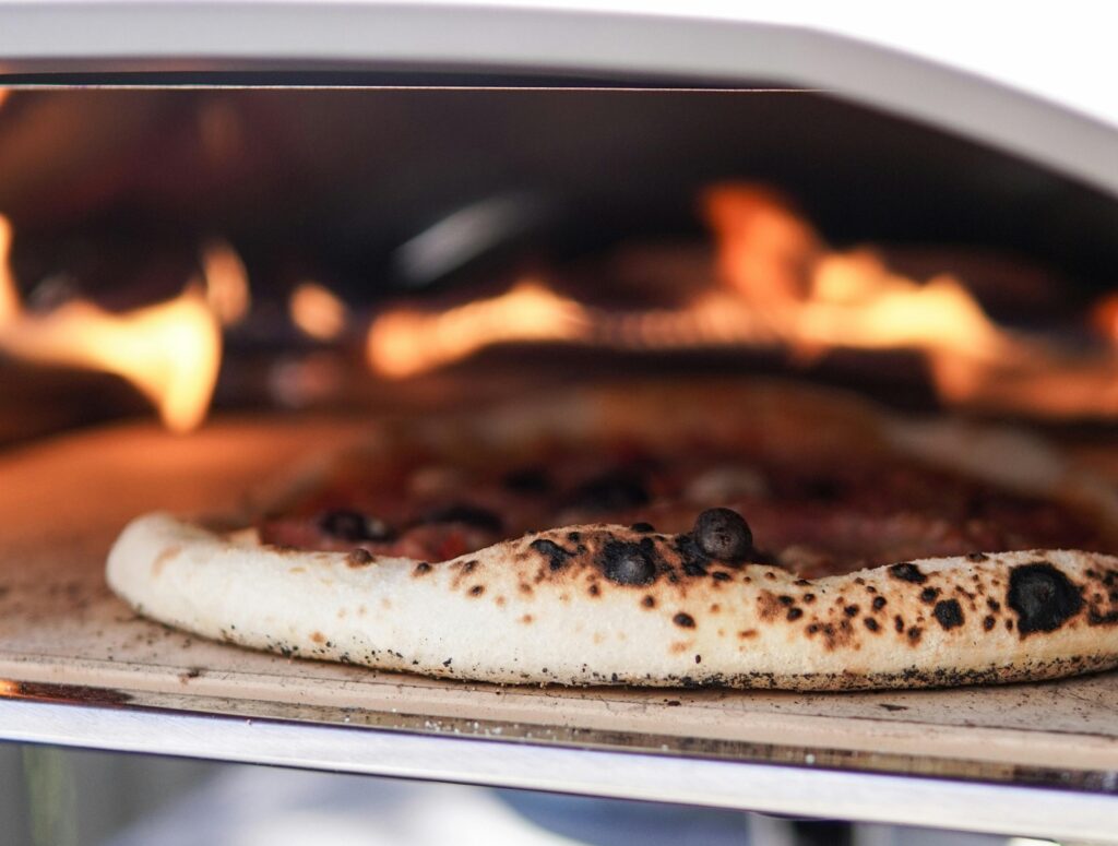 Ooni Koda 16 and Gozney Arc XL gas pizza ovens side by side